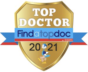 A gold shield with the words top doctor 2 0 2 1